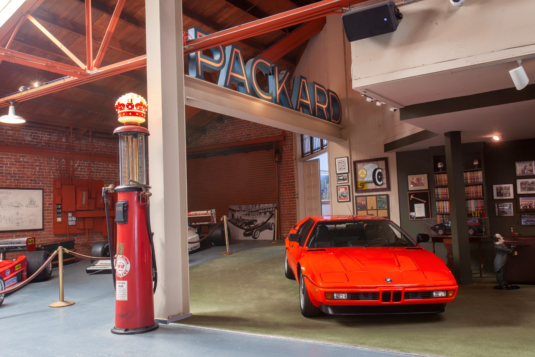 A car beneath the antique signage