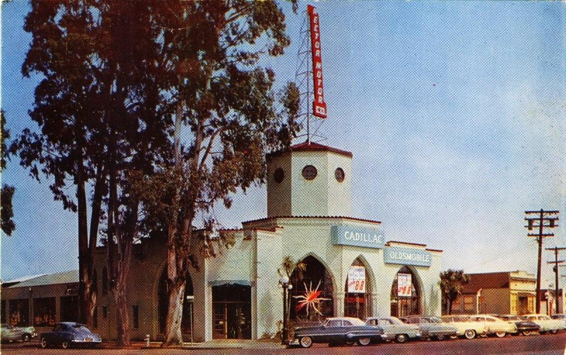 The building as Rector Motor Co., a Cadillac and Oldsmobile dealership, photographed about 1951